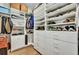 A well-organized walk-in closet features built-in shelves and hanging rods at 1028 Island Preserve Rd, Johns Island, SC 29455