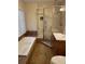 Relaxing bathroom featuring a soaking tub, walk-in shower, a window with natural light and a tiled floor at 104 Legend Oaks Way, Summerville, SC 29485