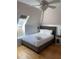 Serene bedroom featuring a cozy bed, natural light from a window, and a stylish ceiling fan at 104 Legend Oaks Way, Summerville, SC 29485