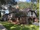 Elegant two-story home with brick and Tudor accents, plus a two-car garage at 104 Legend Oaks Way, Summerville, SC 29485