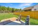 Large, grassy backyard with wooden fence, a patio and a wooden structure for entertainment at 104 Mayfield Dr, Goose Creek, SC 29445