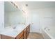 Bathroom featuring double sink vanity, soaking tub, and tile flooring at 104 Mayfield Dr, Goose Creek, SC 29445