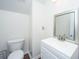 Bathroom featuring a white vanity, mirror, and toilet on a dark hardwood floor at 104 Mayfield Dr, Goose Creek, SC 29445