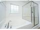 A bathroom featuring a soaking tub and a glass enclosed shower at 104 Mayfield Dr, Goose Creek, SC 29445