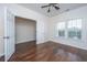 Cozy bedroom with hardwood floors, a ceiling fan, and two windows that let in natural light at 104 Mayfield Dr, Goose Creek, SC 29445