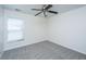 Bright bedroom featuring plush carpet, a ceiling fan, and window at 104 Mayfield Dr, Goose Creek, SC 29445