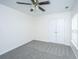Neutral bedroom features plush carpet, a ceiling fan, and double door closet at 104 Mayfield Dr, Goose Creek, SC 29445