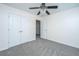 Neutral bedroom features plush carpet, a ceiling fan, and closet at 104 Mayfield Dr, Goose Creek, SC 29445