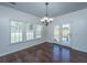 Dining area featuring hardwood floors, modern chandelier, and French doors leading to outdoor space at 104 Mayfield Dr, Goose Creek, SC 29445