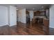 Open-concept kitchen with dark wood cabinetry, stainless steel appliances, and a kitchen island, perfect for entertaining at 104 Mayfield Dr, Goose Creek, SC 29445