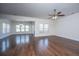 Open-concept living room featuring hardwood floors, a ceiling fan, and plenty of natural light at 104 Mayfield Dr, Goose Creek, SC 29445