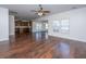Spacious living room with hardwood floors, ceiling fan, and an open layout, ideal for gatherings and relaxation at 104 Mayfield Dr, Goose Creek, SC 29445