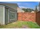 Backyard shed and fence offer additional storage and privacy for the home at 109 Charlesfort Way, Moncks Corner, SC 29461