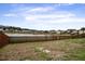 This backyard offers a peaceful pond view, fenced in privacy, and space for outdoor enjoyment at 109 Charlesfort Way, Moncks Corner, SC 29461