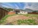 Fenced backyard featuring a screened porch, green space and perimeter plantings at 109 Charlesfort Way, Moncks Corner, SC 29461