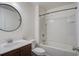 Bathroom with a tub, shower, and a round mirror over the vanity at 109 Charlesfort Way, Moncks Corner, SC 29461