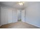 This bedroom offers ample closet space, a ceiling fan, and access to an ensuite bathroom at 109 Charlesfort Way, Moncks Corner, SC 29461