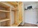Walk-in closet with adjustable wood shelving and a built-in tv at 109 Charlesfort Way, Moncks Corner, SC 29461