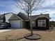 Charming single-Gathering home featuring a two-car garage, brick facade, and well-maintained front yard at 109 Charlesfort Way, Moncks Corner, SC 29461