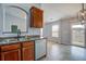 Bright kitchen with dark cabinetry overlooks a patio and backyard through sliding glass doors at 109 Charlesfort Way, Moncks Corner, SC 29461