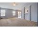Open living area with neutral carpet and natural light at 109 Charlesfort Way, Moncks Corner, SC 29461
