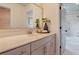 Bright bathroom featuring a sleek vanity with chrome fixtures and an open doorway at 110 Crosscut Ln, Summerville, SC 29486