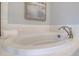 Close up of a soaking tub with white subway tile at 110 Crosscut Ln, Summerville, SC 29486