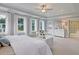 Large primary bedroom with abundant natural light and ensuite bathroom at 110 Crosscut Ln, Summerville, SC 29486