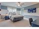 Comfortable bedroom showcasing two-tone walls, neutral carpeting, a ceiling fan, and decor at 110 Crosscut Ln, Summerville, SC 29486