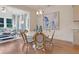 Cozy dining area connects to a living space with a bright window and natural light at 110 Crosscut Ln, Summerville, SC 29486