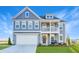 Charming two-story home features a welcoming porch, well-manicured lawn, and a two-car garage at 110 Crosscut Ln, Summerville, SC 29486