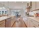 Modern kitchen with stainless steel appliances, large island, white countertops, and an open view to the dining area at 110 Crosscut Ln, Summerville, SC 29486