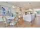 Spacious open-concept kitchen flows into the dining area with views of the cooktop and hood at 110 Crosscut Ln, Summerville, SC 29486