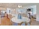 Open-concept kitchen and dining area with a view of the stainless-steel appliances at 110 Crosscut Ln, Summerville, SC 29486