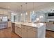 Large kitchen island with seating, stainless steel appliances, and open concept layout to the living area at 110 Crosscut Ln, Summerville, SC 29486