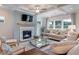 Cozy living room with shiplap fireplace, coffered ceilings, and comfortable seating at 110 Crosscut Ln, Summerville, SC 29486