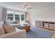 Bright living room with a view of the outdoors, sleek ceiling fan, and comfortable seating at 110 Crosscut Ln, Summerville, SC 29486