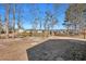 Spacious backyard featuring a scenic pond and a fire pit for outdoor enjoyment at 111 Pacolet St, Summerville, SC 29485