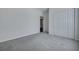 This neutral bedroom features a double closet and leads into another room at 111 Pacolet St, Summerville, SC 29485