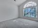 Bright bedroom with a large arched window and neutral carpet at 111 Pacolet St, Summerville, SC 29485