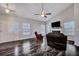 A cozy living room with hardwood floors and a fireplace creates a warm and inviting atmosphere at 111 Pacolet St, Summerville, SC 29485