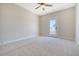 Bright bedroom featuring neutral walls, carpet flooring, a ceiling fan, and a glass door to a balcony at 1118 John Mcenery Rd, Charleston, SC 29412