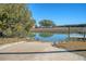 Outdoor shot of boat launch ramp leading into calm water with trees and foliage in the background at 1118 John Mcenery Rd, Charleston, SC 29412