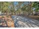 Bocce ball court surrounded by trees and park benches, perfect for outdoor recreation at 1118 John Mcenery Rd, Charleston, SC 29412