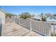 View from a wood deck with white railings overlooking a neighborhood of colorful homes at 1118 John Mcenery Rd, Charleston, SC 29412