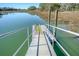Dock extending onto the calm water, featuring a ramp for easy access to boating activities at 1118 John Mcenery Rd, Charleston, SC 29412