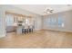 Open living space featuring a modern kitchen and inviting living room with hardwood floors and bright windows at 1118 John Mcenery Rd, Charleston, SC 29412