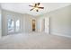 Large main bedroom features carpet, double doors to balcony, and ensuite bathroom entrance at 1118 John Mcenery Rd, Charleston, SC 29412