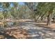 Scenic walking path by the pond, lined with trees providing shade and serenity at 1118 John Mcenery Rd, Charleston, SC 29412