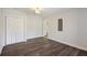 Bedroom featuring luxury vinyl flooring, closet space, and modern ceiling light at 112 Robin Ct, Summerville, SC 29485